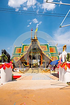 The ceremony of mounting the gable-finial at Phrathat San Don temple photo