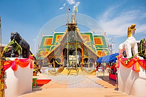 The ceremony of mounting the gable-finial at Phrathat San Don temple photo