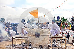 The ceremony of pouring gold Buddha are use is molten metal is poured into a sand mold aluminum to casting Buddha statue.