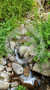 Ceresole Reale, Italy. Small waterfalls between the rocks of a mountain stream, near the Dres waterfall near Lake Ceresole.