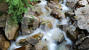 Ceresole Reale, Italy. Small waterfalls between the rocks of a mountain stream, near the Dres waterfall near Lake Ceresole.