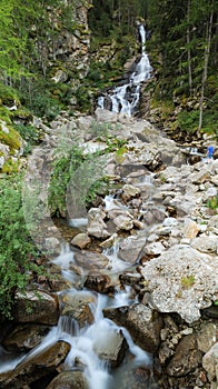 Ceresole Reale, Italy. Small waterfalls between the rocks of a mountain stream, near the Dres waterfall near Lake Ceresole.