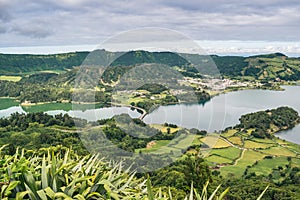 Cerrado das Freiras viewpoint overlooking the famous Sete Cidades Lagoon with cloudy sky, SÃÂ£o Miguel - Azores PORTUGAL photo