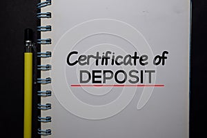 Certificate of Deposit write on a book isolated on black table