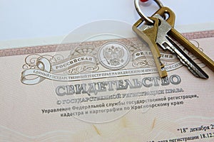 Certificate of ownership of real estate, the keys to a new apartment