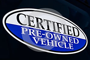Certified Pre-Owned Vehicle sign at a used car dealership II photo