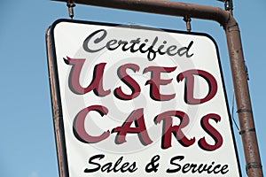 certified used cars writing caption text sign hanging from metal post. p