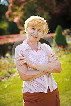 Certitude. Confident Trendy Senior Woman Pensioner with Crossed Arms