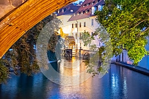 Certovka River and old Water mill under Charles Bridge, Lesser Town of Prague, Czech Republic