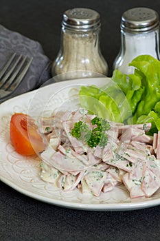 Cervelas salad in a plate on a table