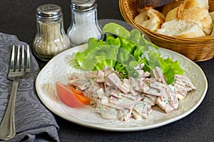 Cervelas salad in a plate on a table