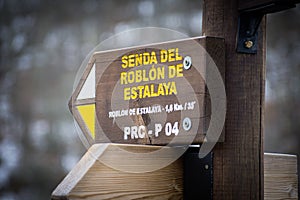 Selective Focus of a Poster of Senda del Roblon de estalaya in Palencia, Spain photo