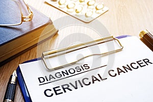 Cervical cancer diagnosis on a clipboard.