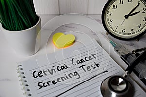 Cervical Cancer Screening Test write on a book and keyword isolated on Office Desk. Healthcare/Medical Concept photo