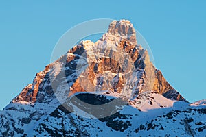 Cervino matterhorn mountain in a winter sunrise