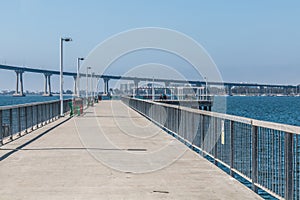 Cesar Chavez Park Pier with Coronado Bridge in San Diego
