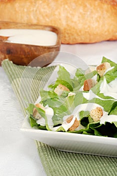 Cesar salad on green napkin