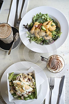 Cesar salad on wooden table