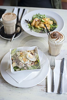 Cesar salad on wooden table