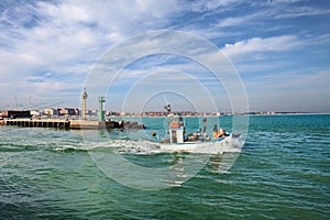 Cesenatico, Forli Cesena, Emilia-Romagna, Italy: fishing boat leaves the port of the picturesque town on the Adriatic Sea coast