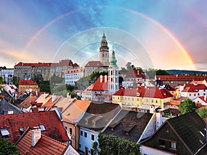 Cesky Krumlov with castle, old town and church with rainbow, Czech Republic photo