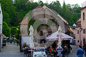 Cesky Krumlov, Czech Republic; 5/18/2019: Restaurant in the old town of Cesky Krumlov within an antique house with a terrace and a