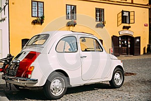 View Of Old Retro Vintage White Color Fiat Nuova 500 Car Parking