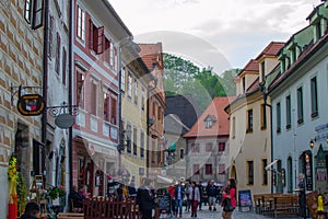 Cesky Krumlov, Czech Republic; 5/18/2019: Street in the old town of Cesky Krumlov with restaurants and typical colorful czech