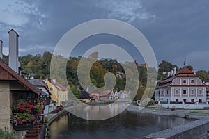 Cesky Krumlov old town with Vltava river and bridges in autumn color morning