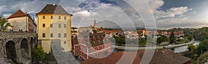 Cesky Krumlov old town with Vltava river and bridges in autumn color morning