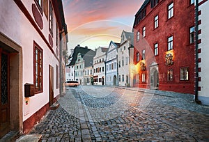 Cesky Krumlov - street in old city at dramatic sunrise, nobody - Czech Republic