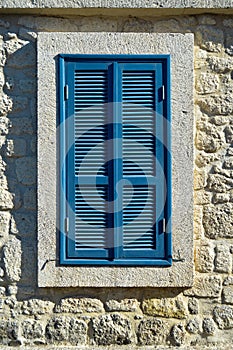 Cesme Alacati located in old antique house blue wooden windows and shutters, Turkey Izmir