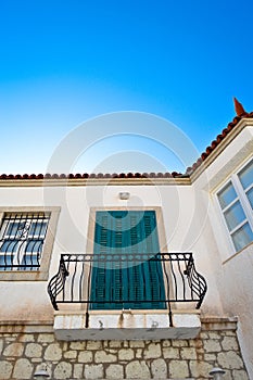 Cesme Alacati located in old antique house blue wooden windows and shutters, Turkey Izmir