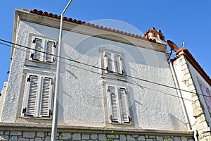 Cesme Alacati located in old antique house white wooden windows and shutters, Turkey Izmir