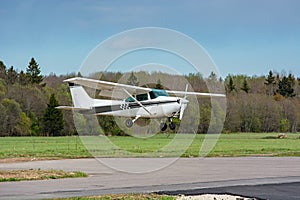 Cessna flies over the runway