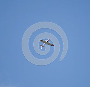 Cessna plane flying upside down