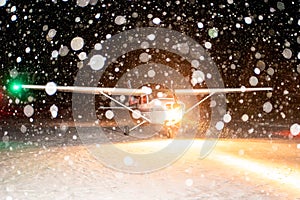 Cessna plane is preparing to fly in a snowstorm