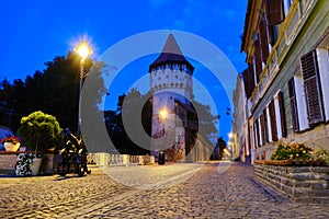 Cetatii street and Carpenters Tower Turnul Dulgherilor, Sibiu, at blue hour, before sunrise.