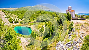 Cetina river source water hole and Orthodox church panoramic view