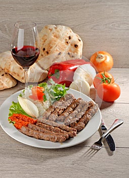 Cevapcici, a small skinless sausage cooked on the barbecue