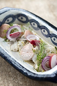 Ceviche marinated fish salad with vegetables