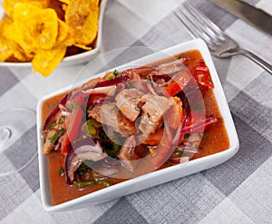 Ceviche served with fried banana in bowl