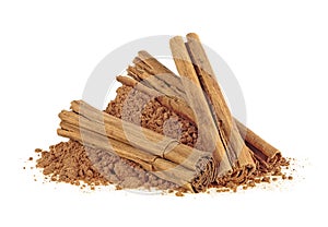 Ceylon cinnamon sticks with powder on white background
