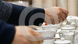 Ceylon tea tasting from degustation cups closeup view