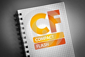 CF - Compact Flash acronym on notepad, technology concept background