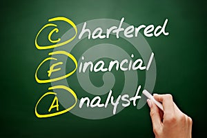 CFA â€“ Chartered Financial Analyst acronym, business concept on blackboard