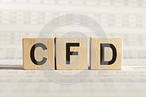 CFD abbreviation - Contract For Difference, on wooden cubes on a light background