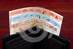 CFP francs in the black wallet