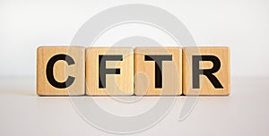 CFTR medical concept. Wooden cubes with the inscription `CFTR - cystic fibrosis transmembrane regulator`. Beautiful white photo
