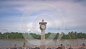 Chachoengsao , Thailand - 7 July 2022: Take in the view on the Bang Pakong River Promenade, where the clock tower contrasts with